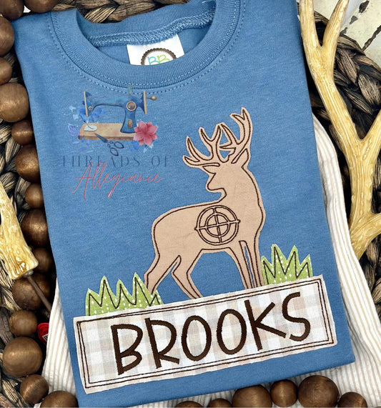 Buck with target appliqué