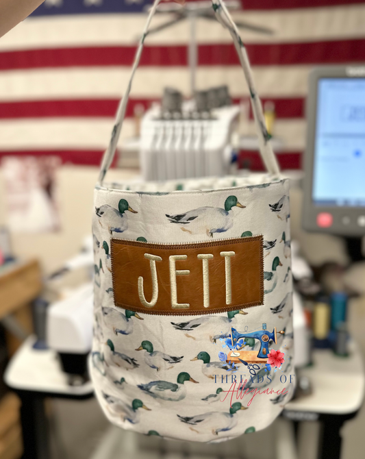 Duck bucket bag with faux leather patch