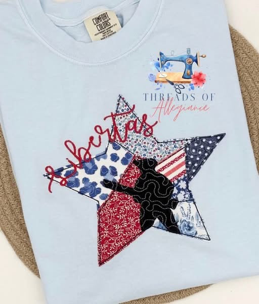 Light blue garment with LIBERTAS patchwork star In fabric mixture